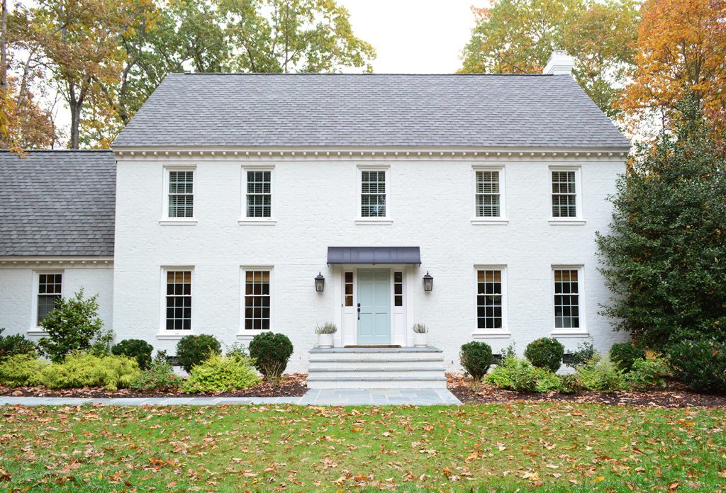 White Painted Brick Home With Bluestone Path