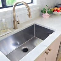 Deep Stainless Steel Sink And Gray Natural Quartz Countertops