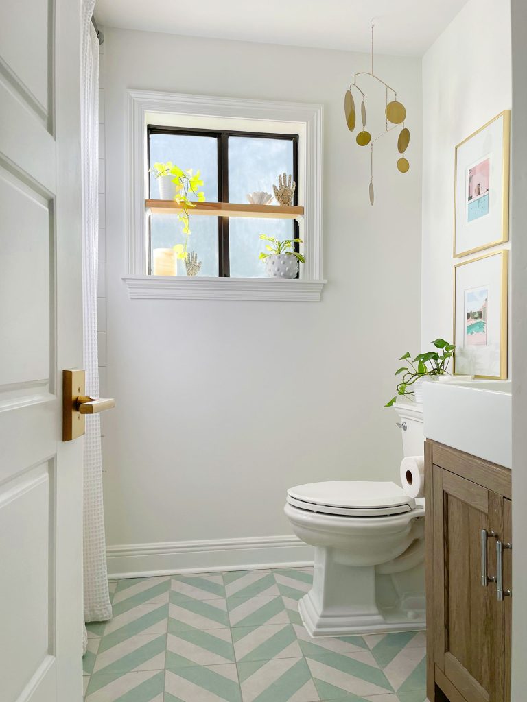 Modern White Bathroom With Mint Chevron Floor And Floating Wood Shelf In Window