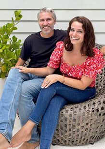 John and Sherry Sitting On Woven Chair