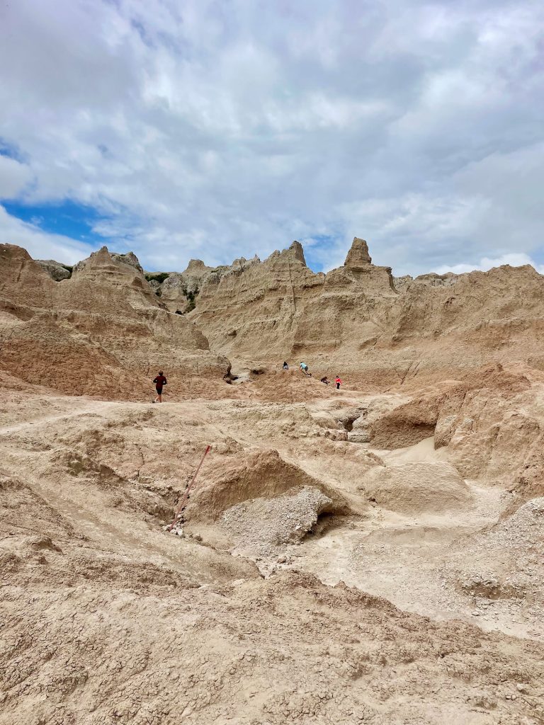 Kids Playing On Rock Formations in Badlands National Park South Dakota