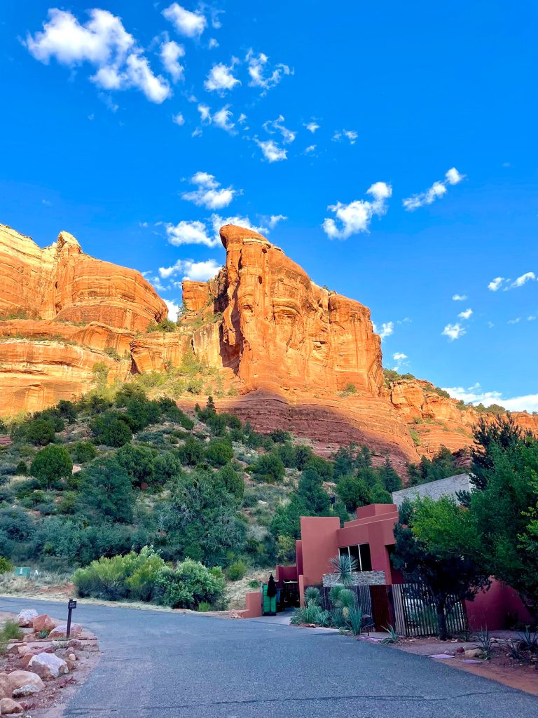 View Of Red Rock Mountains Beyond Road In Sedona Arizona