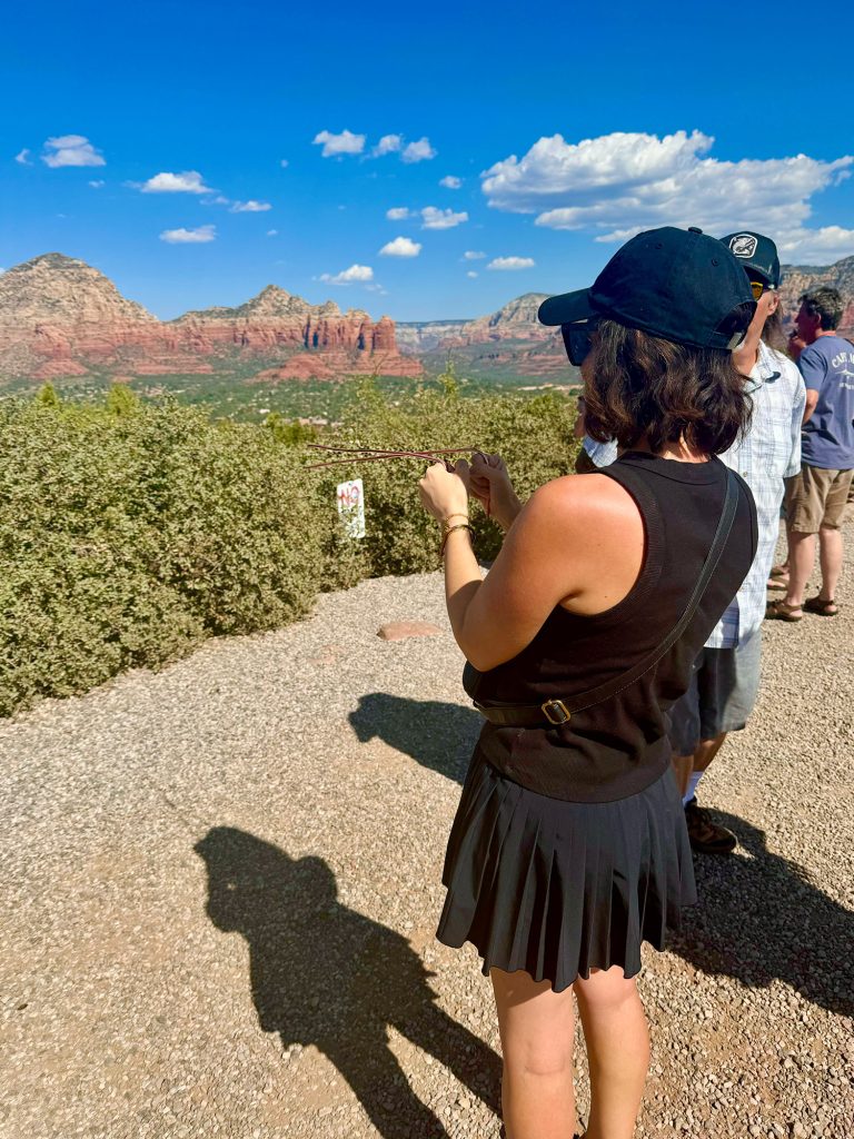 Sherry Holding Metal Poles On Vortex Tour In Sedona Arizona