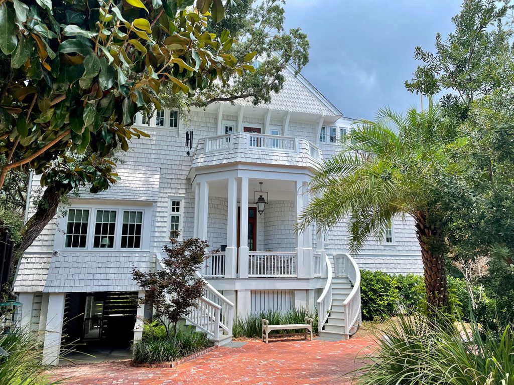 Large White Shingle House Among Trees