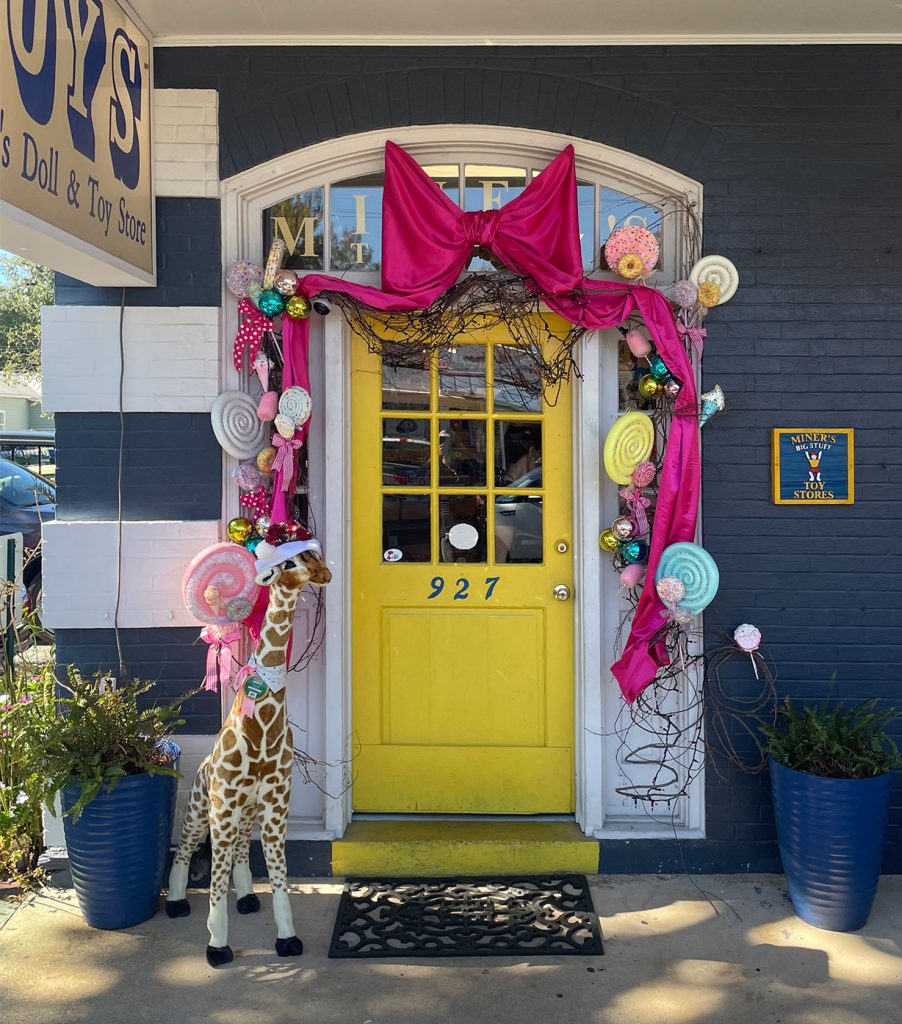 Decorated Yellow Front Door For Miners Doll and Toy Store In Ocean Springs Mississippi