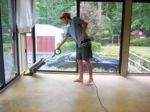 cleaning concrete floor in glass doored sunroom prior to DIY stain application using a vacuum